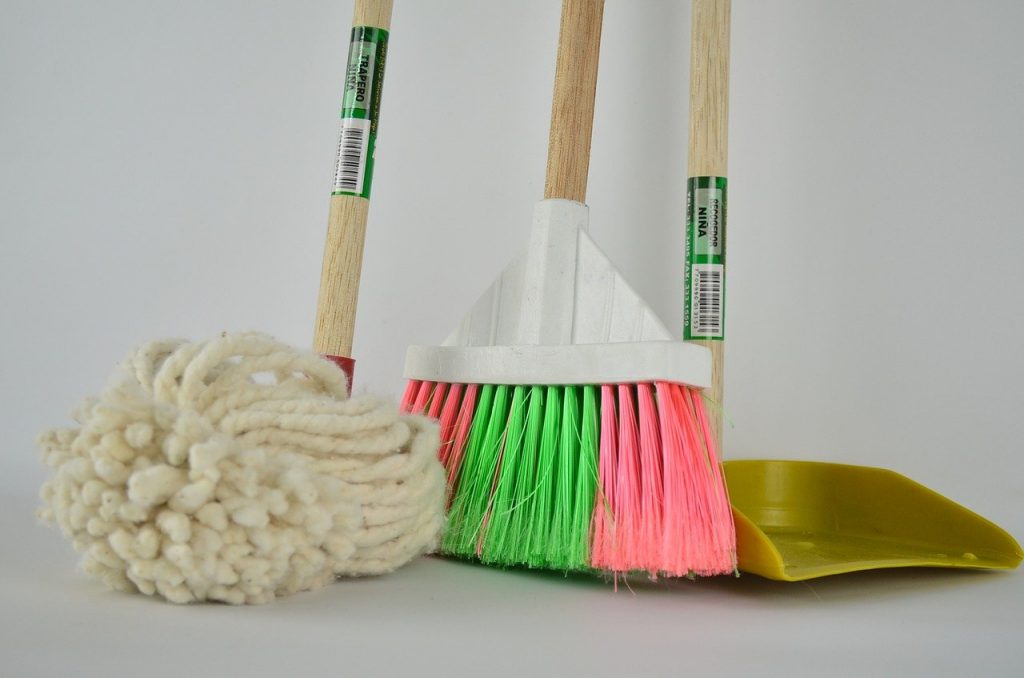 mop broom and dustpan used to clean office floor